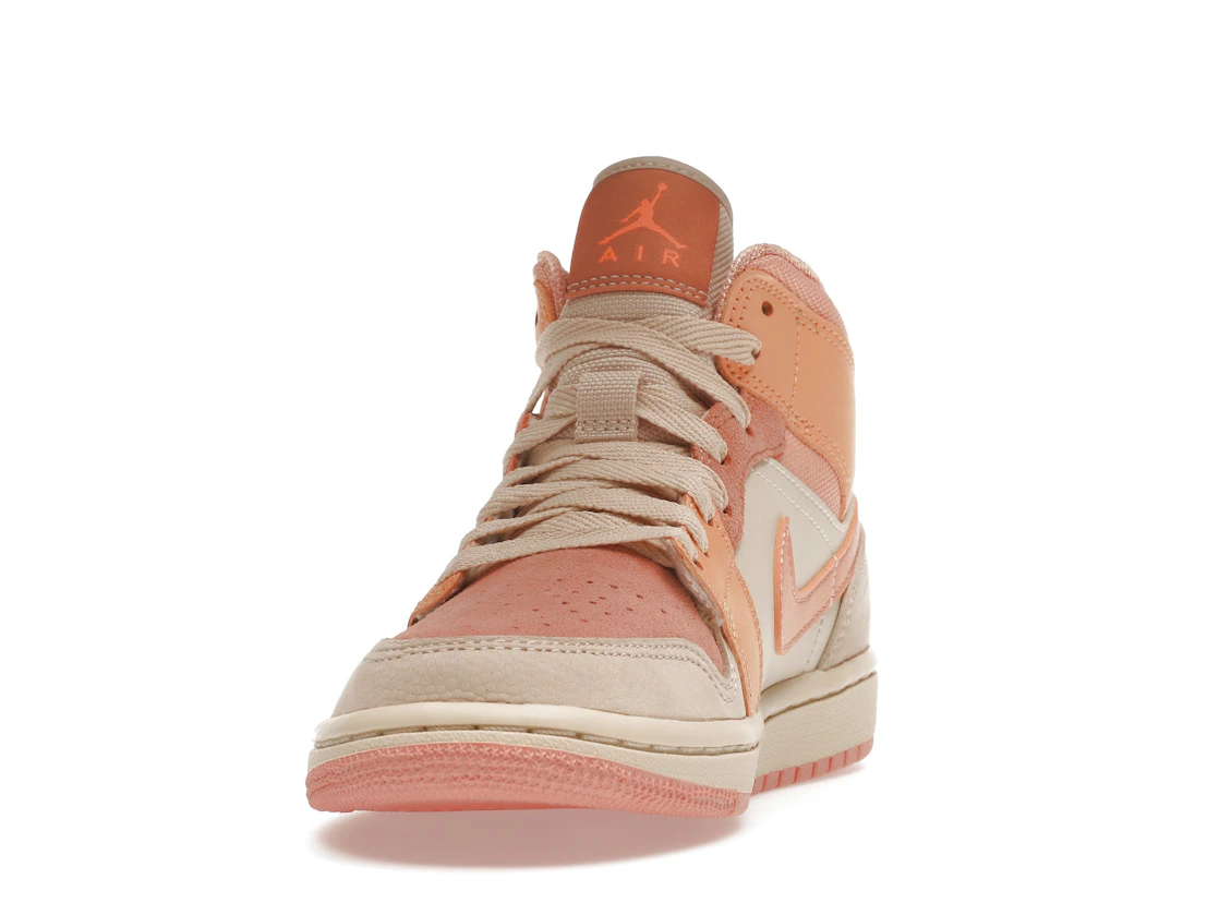 Vue 12 de Jordan 1 Mid Apricot Orange 