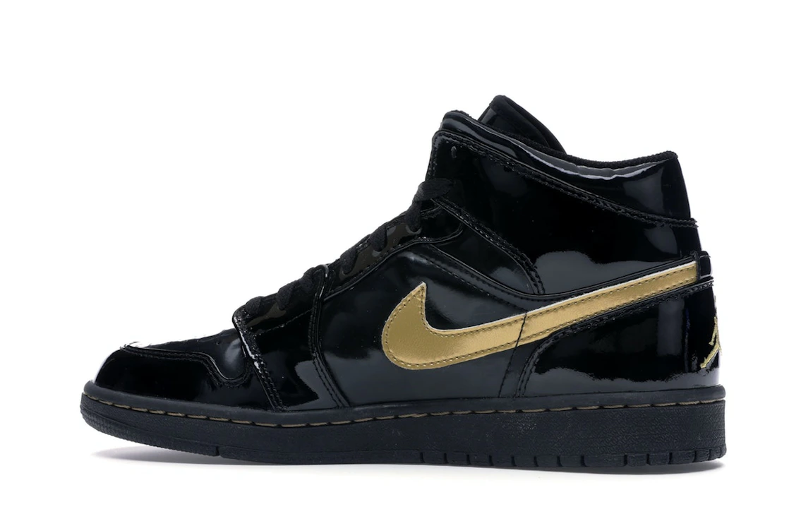 Vue 21 de Jordan 1 Retro Black Metallic Gold (2003)
