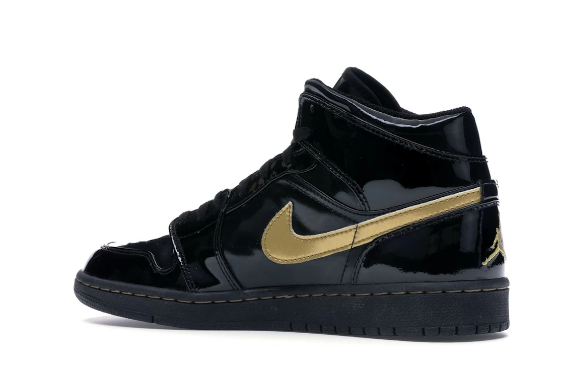 Vue 22 de Jordan 1 Retro Black Metallic Gold (2003)