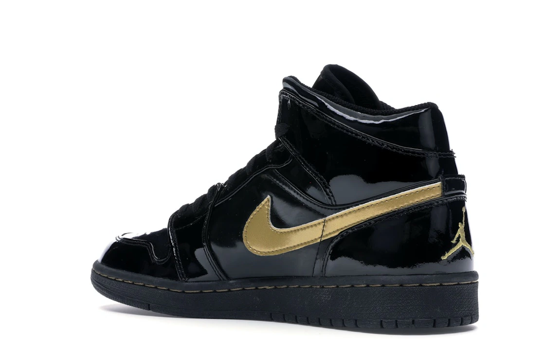 Vue 23 de Jordan 1 Retro Black Metallic Gold (2003)