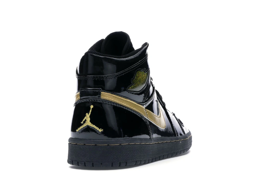 Vue 30 de Jordan 1 Retro Black Metallic Gold (2003)