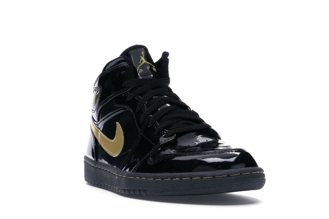 Vue 7 de Jordan 1 Retro Black Metallic Gold (2003)