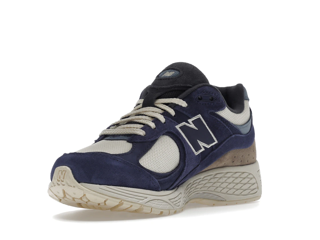 Vue 14 de New Balance 2002R Light Cream Purple
