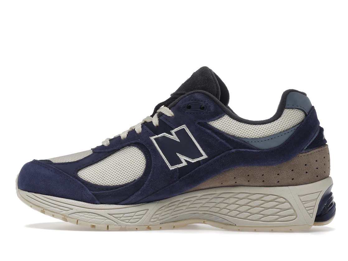 Vue 20 de New Balance 2002R Light Cream Purple