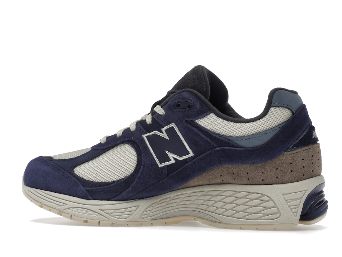 Vue 21 de New Balance 2002R Light Cream Purple