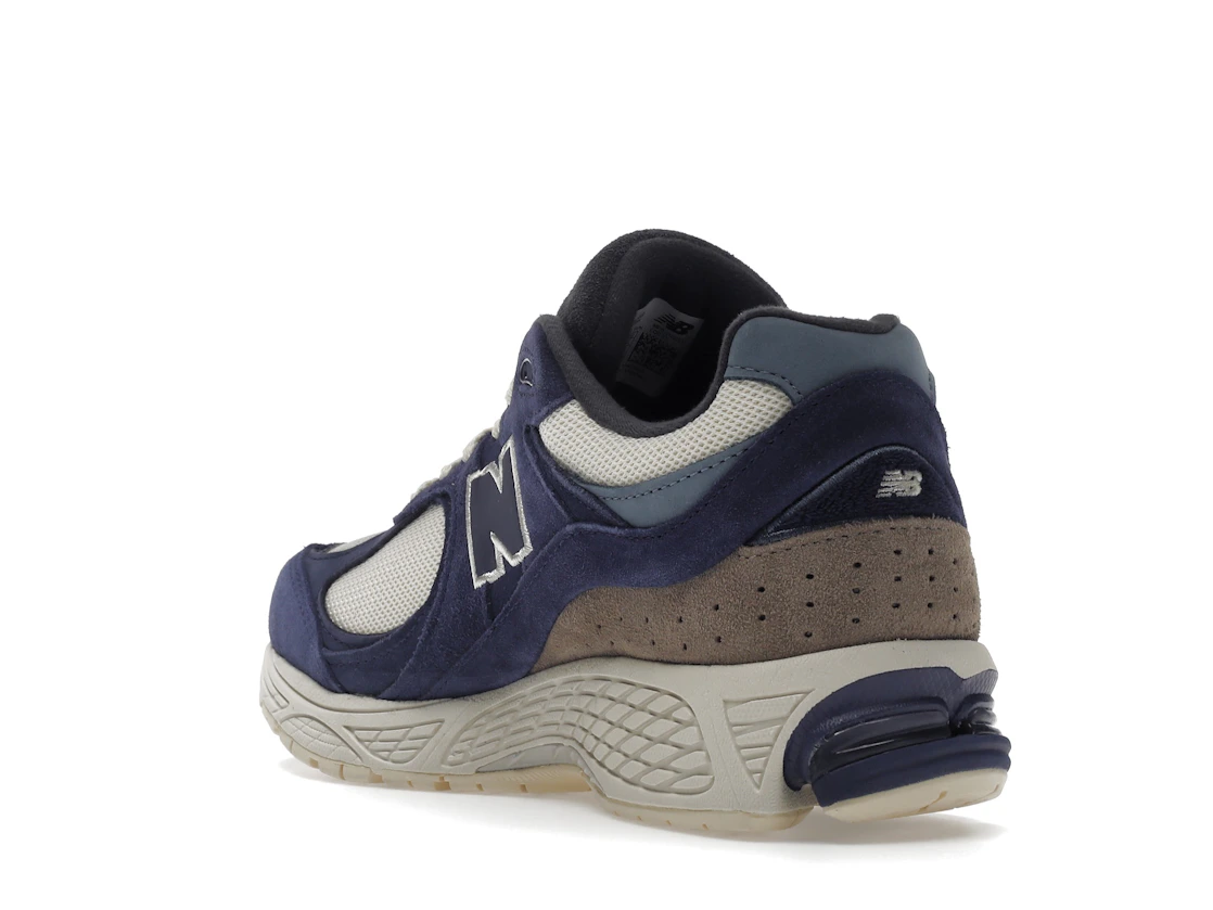 Vue 25 de New Balance 2002R Light Cream Purple