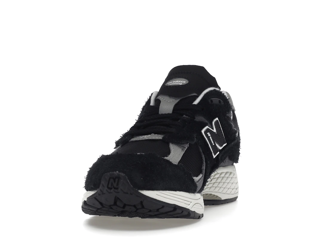 Vue 12 de New Balance 2002R Protection Pack Black Grey