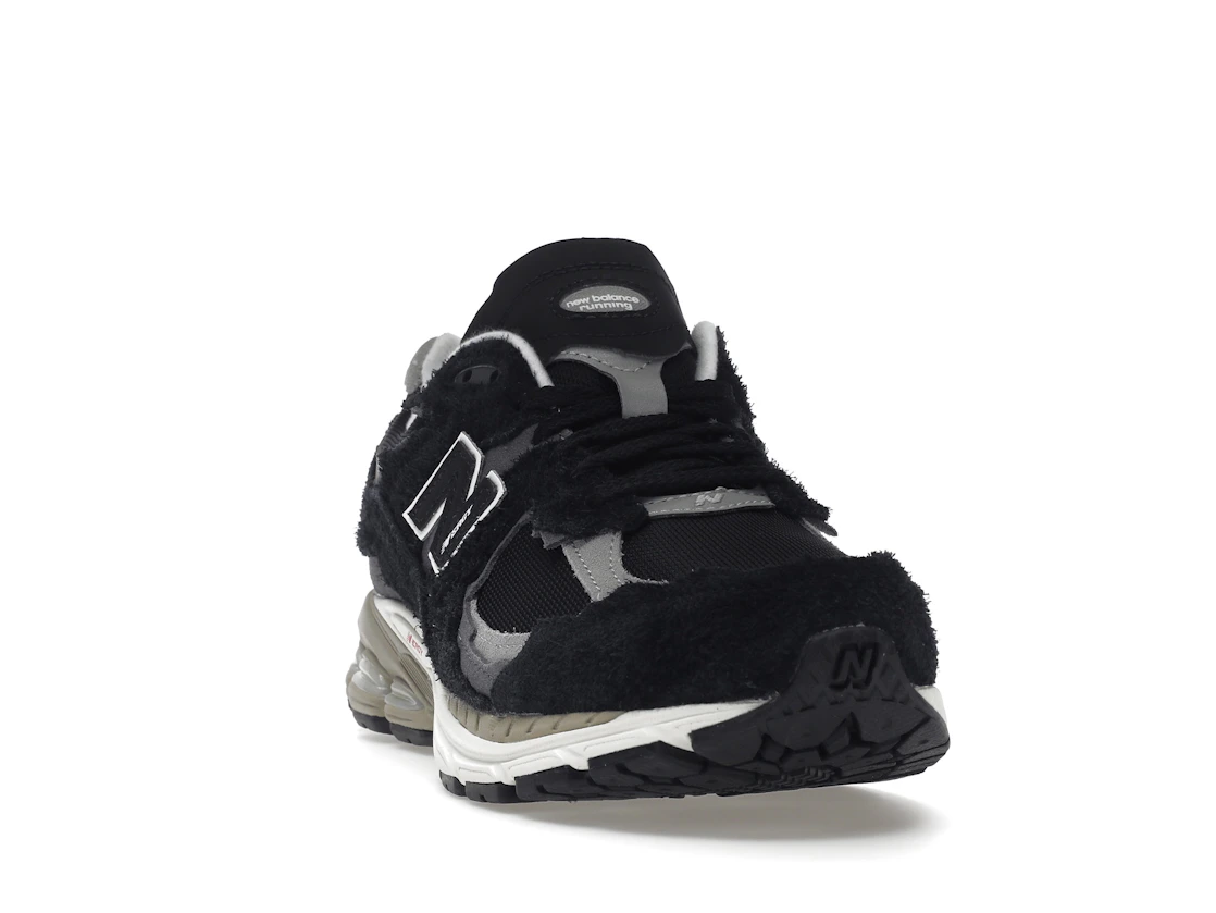 Vue 8 de New Balance 2002R Protection Pack Black Grey